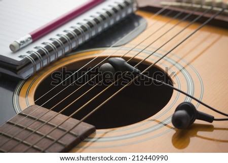 Headphones on guitar, Writing music
