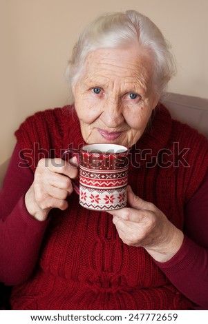 Elderly woman with cup of hot <b>tea , winter</b> season - stock-photo-elderly-woman-with-cup-of-hot-tea-winter-season-247772659