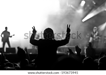 Music concert, silhouette of girls hands raised up, enjoying music in the club, luxury night performance, active lifestyle, having fun. Concert background.