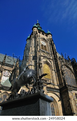 Exterior of Saint Vitus Cathedral showing gothic architecture and Saint George statue.