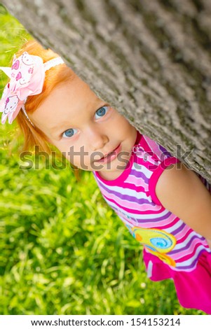 Portrait of a little girl on the nature
