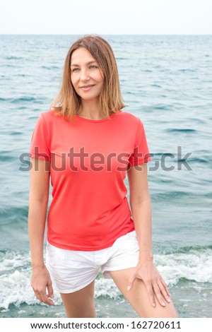 Woman walks by the sea