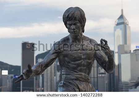 HONG KONG - MAY 27 : Bruce Lee statue on the Avenue of Stars on May 27, 2013 in Tsim Sha Tsui, Hong Kong. The statue is one of the main attractions on the famous waterfront promenade.
