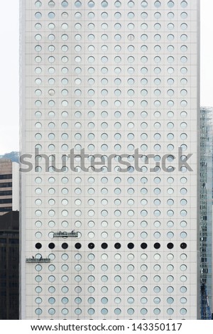 HONG KONG - JUNE 28 : round windows of Jardine House in Central on June 28 2012. It is the Hong Kong's first modern skyscraper. the round windows is one of the characteristic