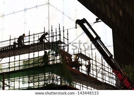 Construction worker silhouette at work
