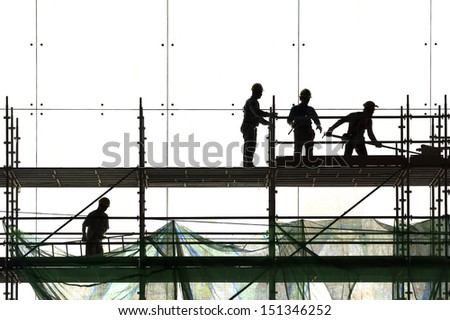 Construction worker silhouette at work