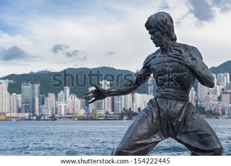 Hong Kong - Sept. 13 : Bruce Lee Statue On The Avenue Of Stars On Sept 13, 2013 In Tsim Sha Tsui, Hong Kong. The Statue Is One Of The Main Attractions On The Famous Waterfront Promenade.