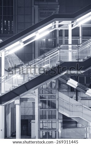 Futuristic stairway and pedestrian walkway in new modern building