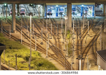 Train tracks in switch yard in Hong Kong at night