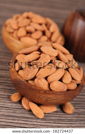 Roasted almonds in wooden bowl
