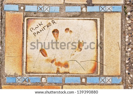 CANNES, FRANCE - MAY 11 : Autograph and forepaw print of Pink Panther on a clay tile near Film Festival Palace in Cannes, France on May 11, 2013.
