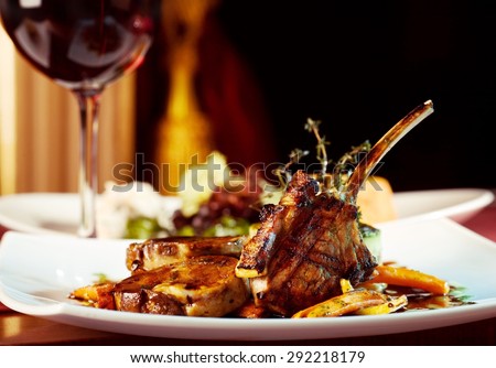 luxury dinner served on  the table with glass of red wine