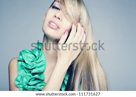 portrait of sexy caucasian young woman with long blond hair, beautiful eyes, sensual lips and clean skin