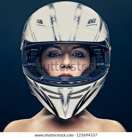 Sexy Woman In Helmet On Dark Background