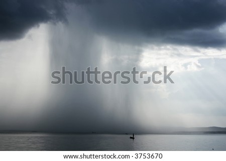 Thunderstorm cloudburst. The effective sky and lake