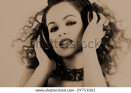 DJ girl listening music in headphones