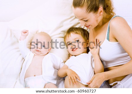 happy mother with two son