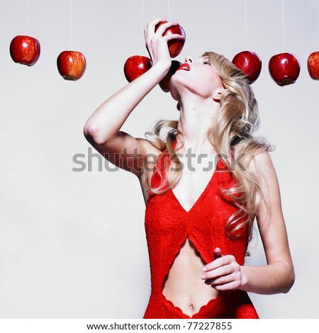 Beautiful woman with elegant dress with apples. Fashion photo
