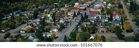 This is a small town in the western part of the United States. It is autumn and shows small town America with houses lined up on tree lined suburban streets.