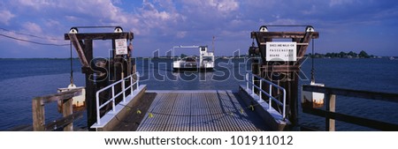 This is a dock in Maryland. You can see a ferry in the distance that has just left the dock.