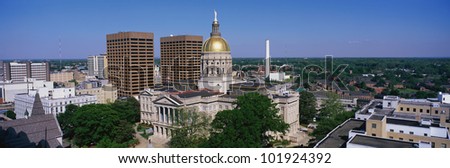 This is the Georgia State Capitol and skyline in daylight.