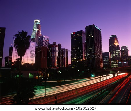 The Harbor Freeway with Los Angeles skyline at night, California