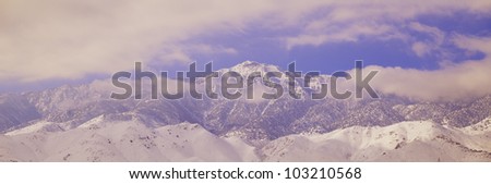 Snowy mountains and clouds in Sierra Nevada Mountains, California