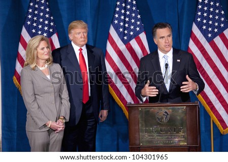 LAS VEGAS - FEB 2: Mitt Romney (R) speaks as Donald Trump and Romney\'s wife, Ann Romney, watch at the Trump Hotel on February 2, 2012 in Las Vegas, Nevada. Trump is endorsing Romney for president.