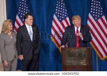 LAS VEGAS - FEB 2: Donald Trump (C) endorses Mitt Romney (2nd-L) for president as he listens with his wife, Ann Romney, at Trump\'s hotel on February 2, 2012 in Las Vegas, Nevada.