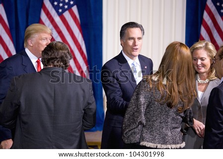 LAS VEGAS - FEB 2: Mitt and Ann Romney speak with an unidentified person at the Trump hotel on February 2, 2012 in Las Vegas, Nevada. Donald Trump has endorsed Romney for president.