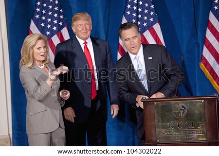 LAS VEGAS - FEB 2: Mitt Romney (R) speaks as Donald Trump and Romney's wife, Ann Romney, listen at the Trump Hotel on February 2, 2012 in Las Vegas, Nevada. Trump is endorsing Romney for president.