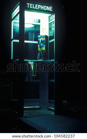 Telephone booth at night with interior lights