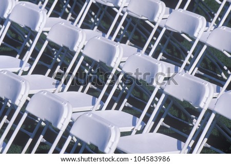 Rows of folding chairs preceding a ceremony