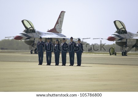 APRIL 2007 - Six US Air Force pilots standing at attention in front of their F-16C Fighting Falcons at the 42nd Naval Base Ventura County Air Show at Point Mugu, Ventura County Southern California.