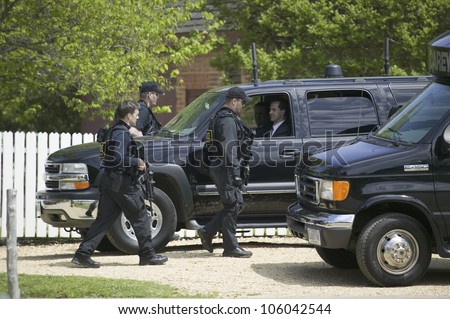 Secret Service agents and black government SUV\'s in Williamsburg Virginia on May 4, 2007 in anticipation of the arrival of Her Majesty Queen Elizabeth II and Vice President Dick Cheney