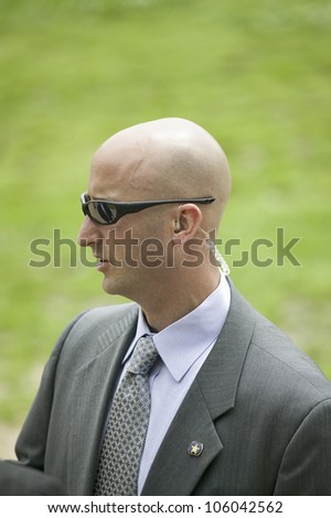 Secret Service agent with sun glasses in Williamsburg Virginia on May 4, 2007 in anticipation of the arrival of Her Majesty Queen Elizabeth II and Vice President Dick Cheney