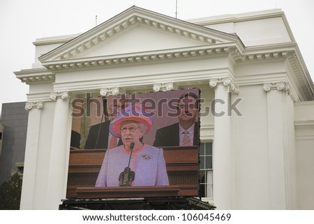 Her Majesty Queen Elizabeth II speaking on a large television monitor to the Virginia State Assembly, at the Virginia State Capitol in Richmond Virginia, May 3, 2007
