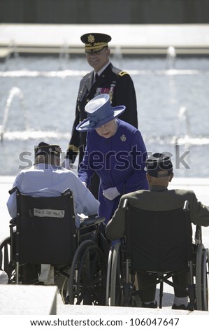 Her Majesty Queen Elizabeth II interacting with World War II Disabled Veterans at the National World War II Memorial, Washington, DC, May 8, 2007