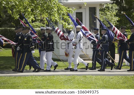 Military branches carrying the fifty state flags on May 7, 2007 at the White House, as part of the welcoming of Her Majesty Queen Elizabeth II to Washington, DC and America