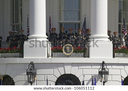 Marine Band Trumpeters standing at ease behind Presidential Seal May 7, 2007, Washington, DC