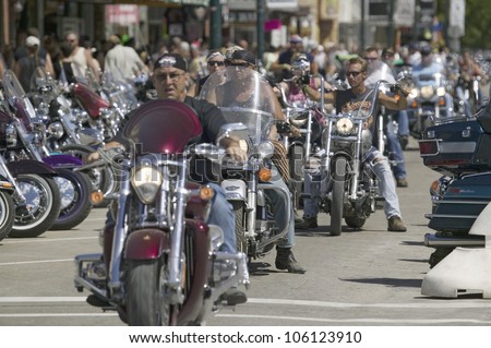 Motorcyclists driving down Main Street Sturgis at the 67th Annual Sturgis Motorcycle Rally, Sturgis, South Dakota, August 6-12, 2007