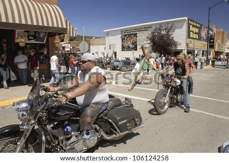 Motorcyclists driving down Main Street Sturgis at the 67th Annual Sturgis Motorcycle Rally, Sturgis, South Dakota, August 6-12, 2007