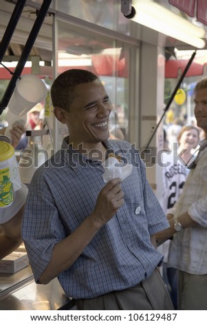 U.S. Senator Barak Obama eating corn dog while campaigning for President at Iowa State Fair in Des Moines Iowa, August 16, 2007
