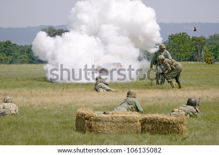 World War II reenactment of a battle between American infantryman and German soldiers, at Mid-Atlantic Air Museum World War II Weekend and Reenactment in Reading, PA held June 18, 2009