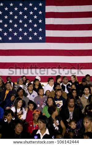 Crowd in front of American flag during Barack Obama Presidential Rally, October 29, 2008 in Rocky Mount High School, North Carolina