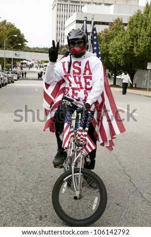 Patriotic bicyclist dressed in American Flag at early vote for change Presidential rally, October 29, 2008 at Halifax Mall, Government Complex in Raleigh, NC