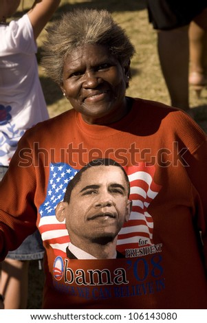 African American senior woman in red sweat shirt at Early Vote for Change Barack Obama Presidential rally at Bonanza High School, Judy K. Cameron Stadium in Las Vegas, NV, October 25, 2008