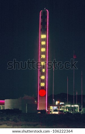 JULY 2004 - World\'s largest thermometer in neon at night in California\'s hottest city, Baker, California