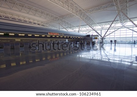 APRIL 2006 - Empty ticket counter and reflections at JFK International Airport, New York City, New York