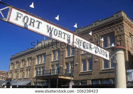 FEBRUARY 2005 - Banner at the Fort Worth Stock Yards with historic hotel, Ft. Worth, TX